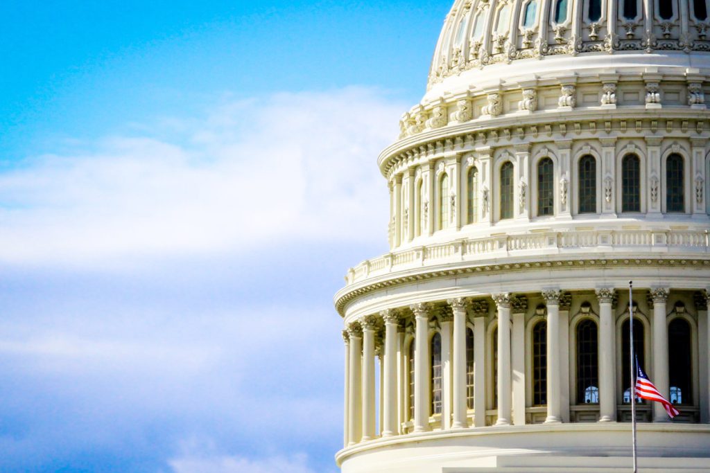 Dome of the U.S. Capitol building against a blue sky