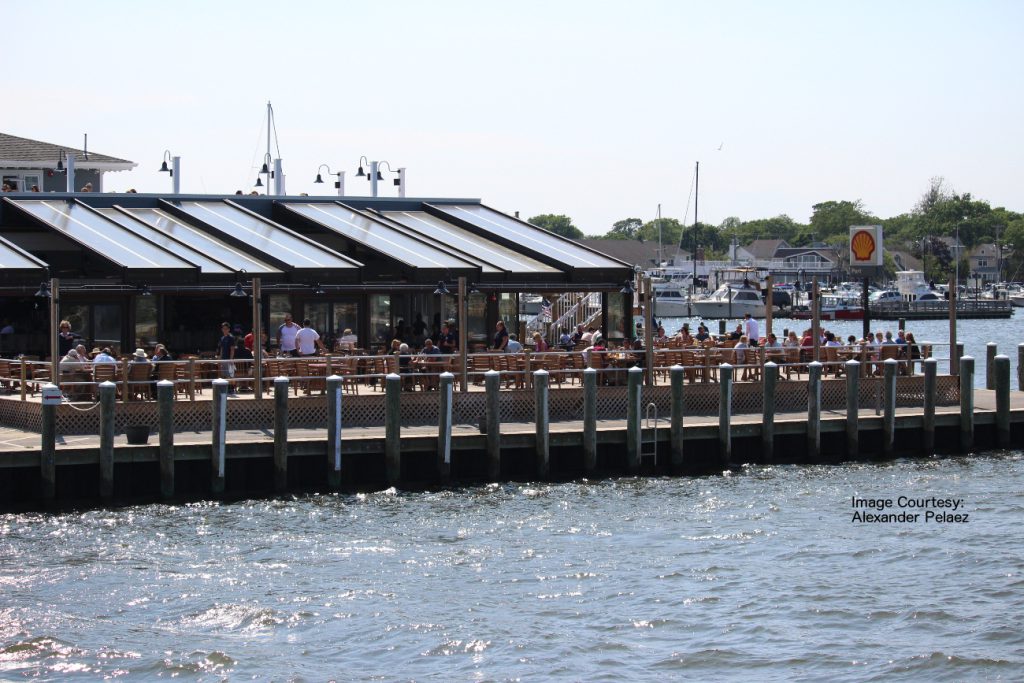 Waterfront restaurant with an outdoor deck over a harbor